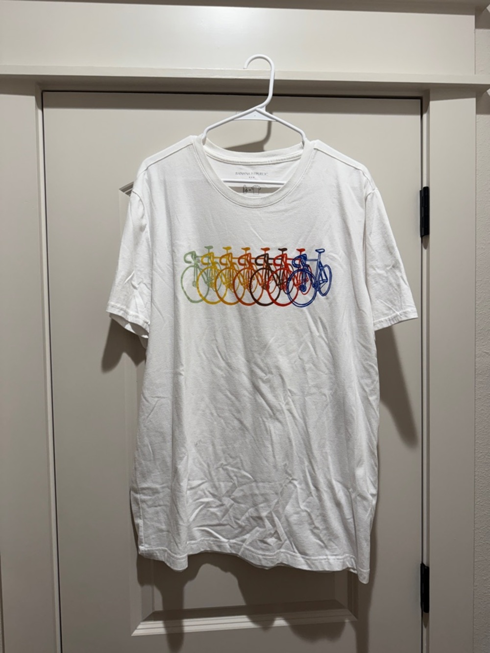 White Tee with Multicolor Rainbow Bicycle Graphic